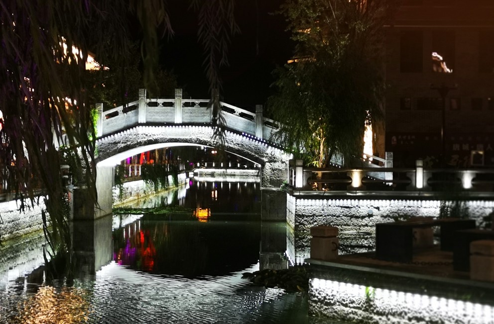 Stone bridge lighted up with RGB wall washer light